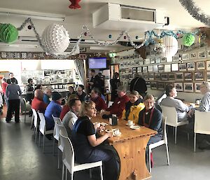 Tourists enjoying a scone in the Macquarie Island mess