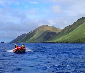 Macquarie Island boating team on the east coast with Varne Plateau in the background.