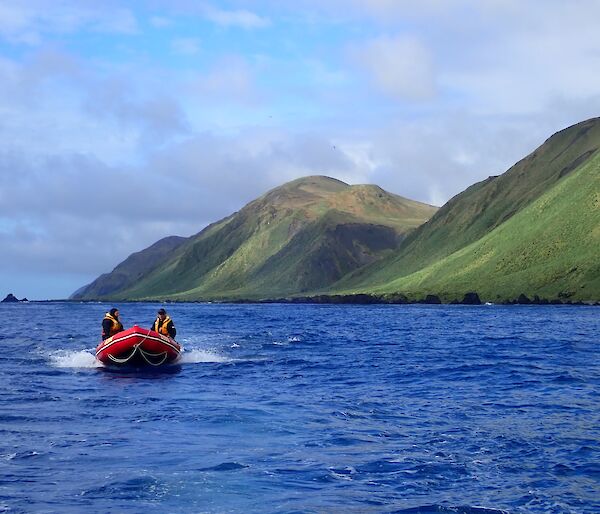 Macquarie Island boating team on the east coast with Varne Plateau in the background.