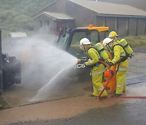 Macca fire team members combat a simulated LPG fire.