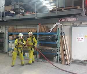 Macca fire team members clear the green store during the simulated fire training.