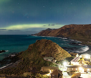 Macquarie Island aurora with station in foreground.