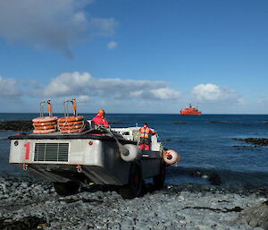 An AAD LARC heading down a bouldery Landing Beach on Macquarie Island