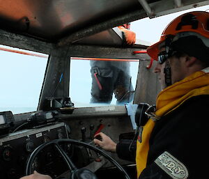 An image taken inside the wheelhouse of a LARC as it is driven into Macquarie Island station