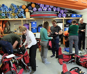 Expeditioners prepare their field packs in the Fieldd Store