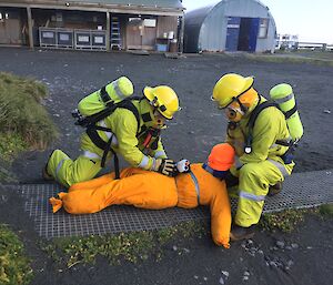 BA1 & 2 recover a dummy from the Post Office during a fire response exercise at Macca