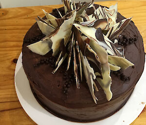 The birthday cake in detail with white and milk chocolate shards piled high on top