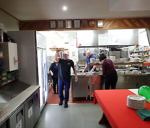 Peter Lecompte delivers pizzas in boxes at Macquarie Island