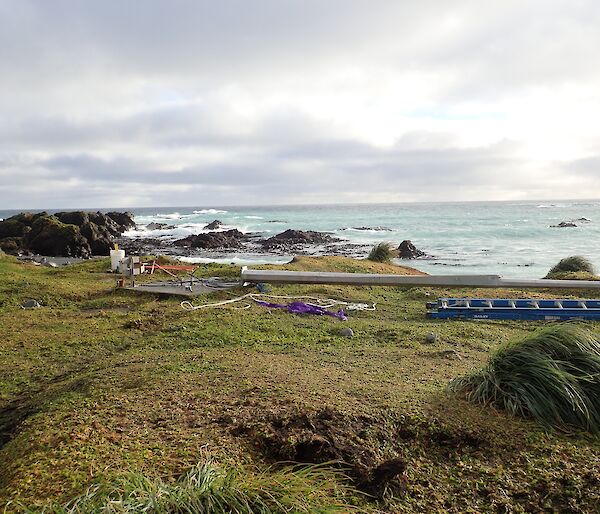 The old BOM anemometer mast lying on the ground on the isthmus, Macquarie Island