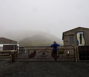 a view of Macquaire Island Research Station with Cathryn O'Sullivan the current Doctor at the front gate