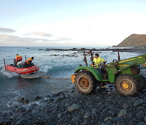 Dieso Chris Burns launching an IRB with Chris Howard and Jez Bird at Landing Beach, Macquarie Island