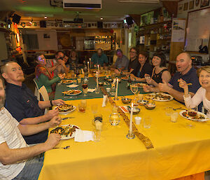 Macca expeditioners enjoying a Saturday night Indian themed meal