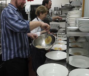 Helping in the kitchen to plate up the Midwinter Dinner