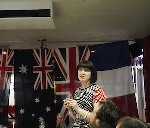 A toast by Doctor Cathryn to the other AAD stations — To Davis, Casey and Mawson!