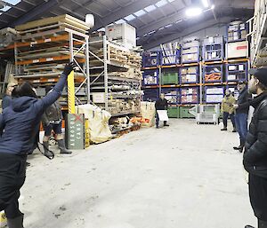 Cathryn throwing a toilet roll into a cage pallet during the Green Sponge Games on Macca