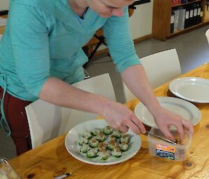Danielle helping to make dishes for the recent summer soiree held at Macca