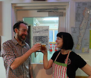 Jez and the Doc clink glasses of Pimms to celebrate a successfully executed soiree