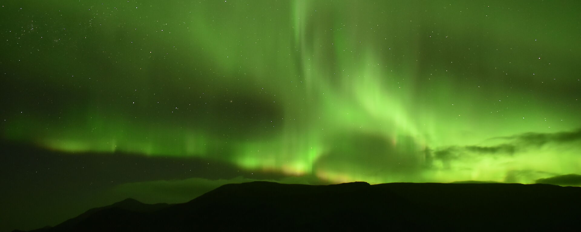 Green sky at night