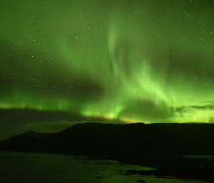 Green sky at night