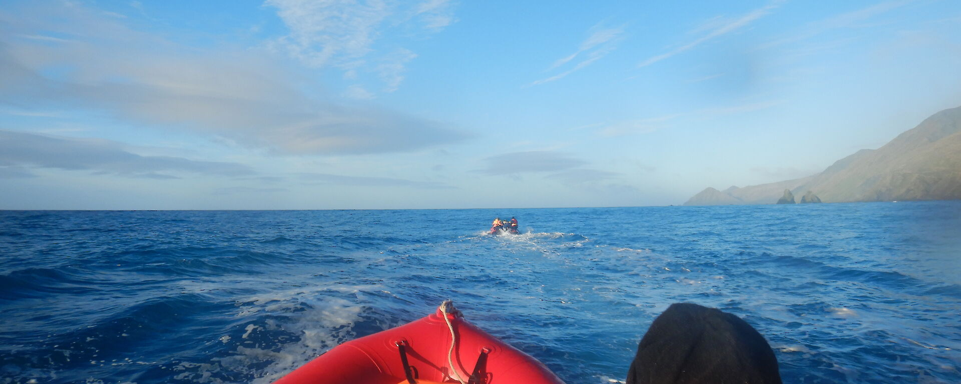 a view looking south to the Nuggets from one of the Macquarie Island IRBs (inflatable rubber boats with competent crew Greg’s head in the foreground