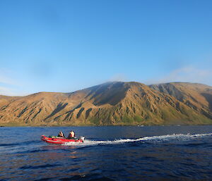Angus Cummings, Richard Youd and Chris Burns in an IRB heading south along Macquarie Islands east coast in the back ground