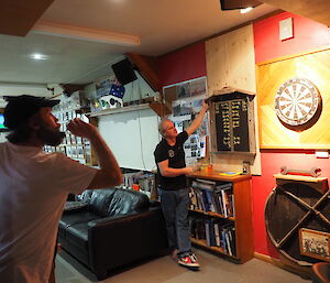 Peter scoring at darts to win the Singles final in the recent Macca Darts Competition
