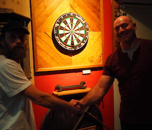 Tim Kerr shaking hands with Peter after winning the Singles final in the Macca Darts Competition