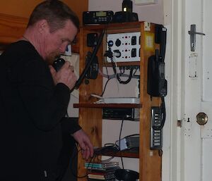 Chris talking to station on the VHF radio on the daily ‘sched’ (scheduled radio call)