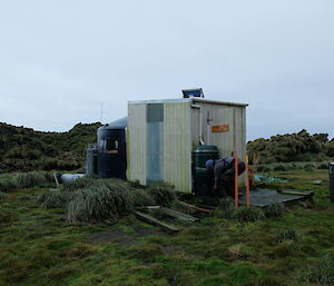 At David Point Shelter an expeditioner has popped outside to fill the kettle.