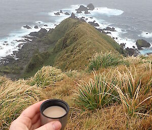 Rich having a cup of tea perched out on the ridge-line of Precarious Point supervising some Southern Giant Petrels as they get ready to start their breeding season