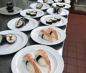 Plates of prawn nigiri and sushi waiting to be put on the train for our Saturday evening meal.