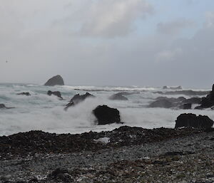 A view taken out to sea in Hasselborough Bay on Macca’s west coast with a succession of larger breaking waves coming in