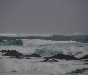 A succession of breaking waves coming through off Handspike Point on Maccas west coast