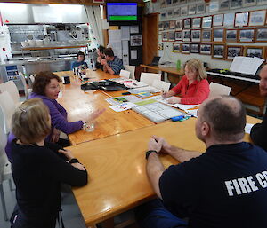 The Incident Management Team in the mess planning the details of the search and rescue as the details emerge at the start of the exercise