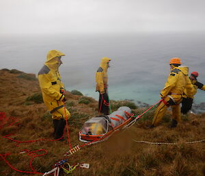 In the final stages of the rescue exercise Chris B gets ready to lower Angus in the stretcher with Jez and Greg as attendants down the hill under instruction from Rich our SAR Lord