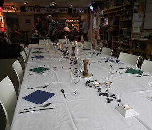 Table setting with pebbles used as the centerpiece for Ali’s birthday