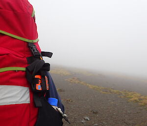 A SPOT device fixed to the outside of a pack — it is an essential part of any field kit at Macca