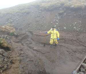 The dam after the water has been drained — full of silt and mud