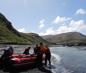 Stu, Cathryn, Angus and Chris dragging the boat around to launch from Brothers Point