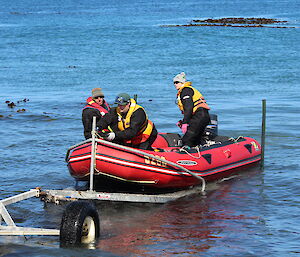 Tommy makes fast the bowline as Danielle drives the boat onto the trailer during a recent training exercise