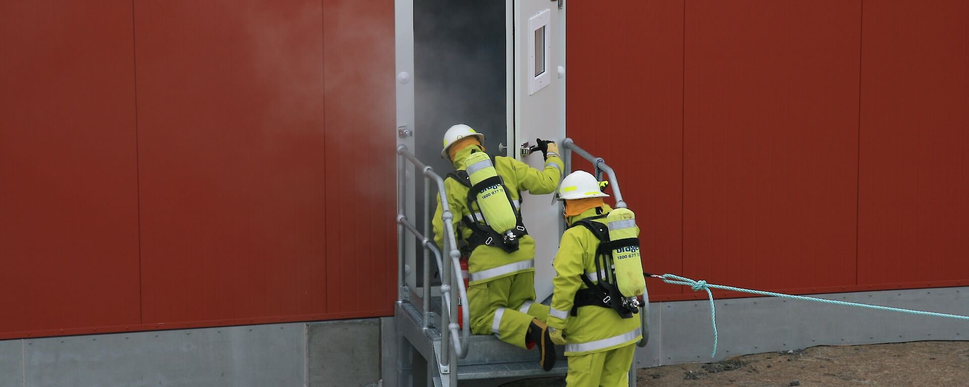 Firefighters enter building in training exercise