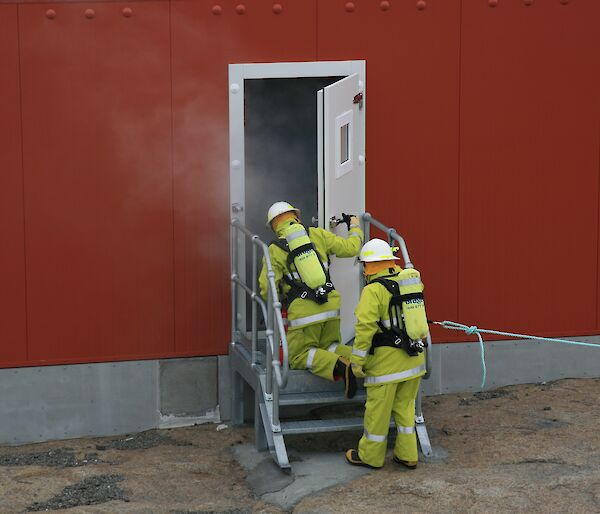 Firefighters enter building in training exercise