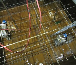 Plumbers cleaning the water tanks