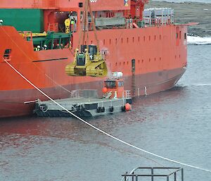 Dozer being unloaded from Aurora Australis by crane