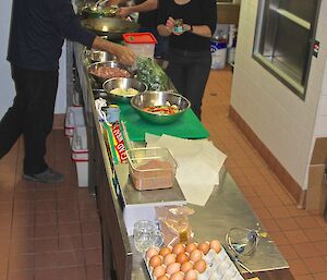 Kim the station chef is helping the group cook