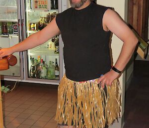 Paul arrives for his birthday dressed in a grass skirt