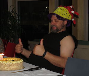 Paul prepares to blow out the candles on his birthday cake