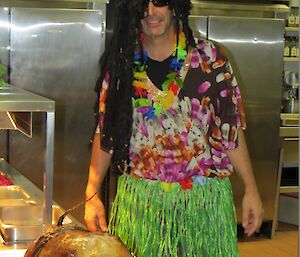The station chef Kim dressed up for the party with the spit roasted pig