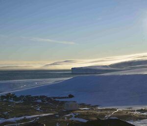 The wind blows snow across the water of Kista Strait