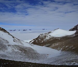 The view from Fank Peak across the open plateau and surrounding mountains